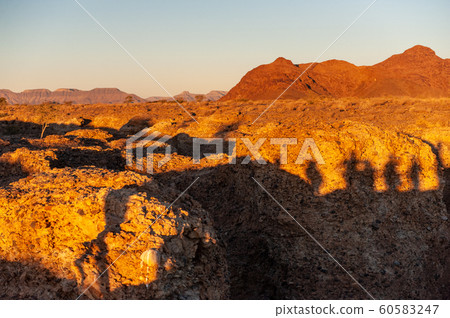 Red glowing desert rocks at Sesriem 60583247