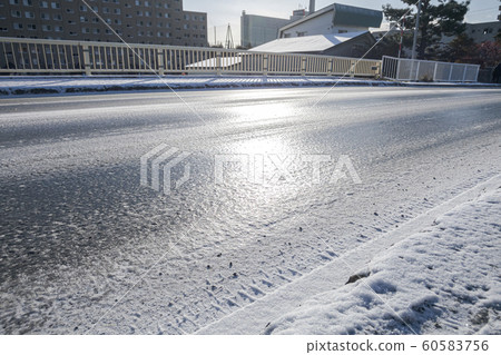 Frozen road surface 60583756