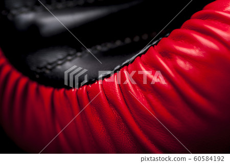 Close-up elements of red boxing leather gloves 60584192