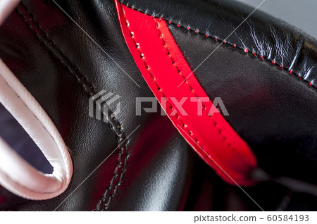 Close-up elements of red boxing leather gloves 60584193