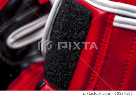 Close-up elements of red boxing leather gloves Close-up elements of red boxing leather gloves 60584195