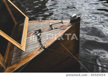 Pleasure boat moored by a water rope 60585054