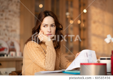 Pretty woman with long hair feeling sad 60585456