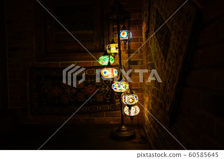 Vintage wall lamp with eastern ornates on it. 60585645