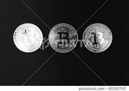 Bitcoin on a black and white background. Cryptocurrency trading.  60585742