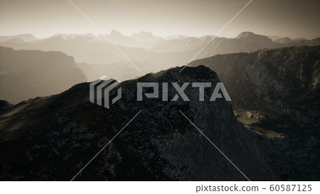 Dramatic sky over steps in a mountain. 60587125