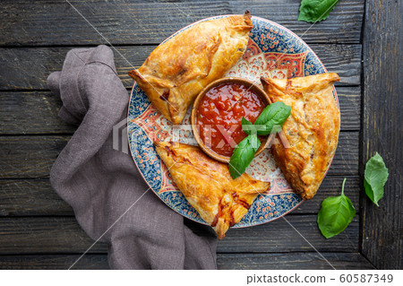 Samsa or samosas with chicken fillet 60587349