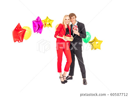young happiness couple enjoy posing with colorful ballons in new year celebration party young happiness couple enjoy posing with colorful ballons in new year celebration party 60587712