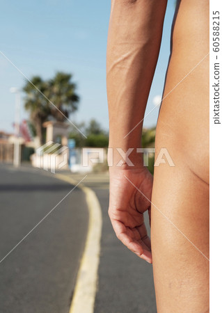naturist man naked on the street. naturist man naked on the street. 60588215