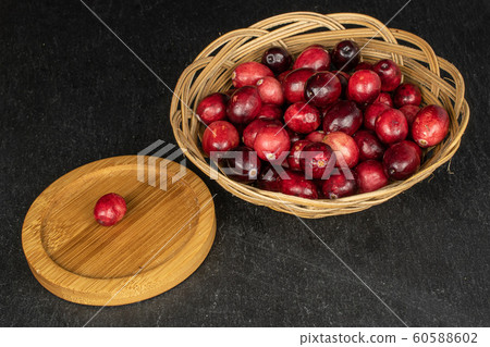 Fresh red cranberry on grey stone Fresh red cranberry on grey stone 60588602