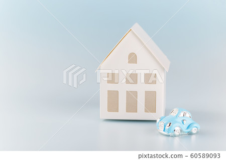 White little house on blue background 60589093