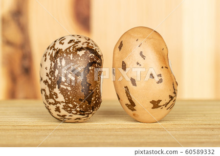 Brown speckled bean on wood Brown speckled bean on wood 60589332
