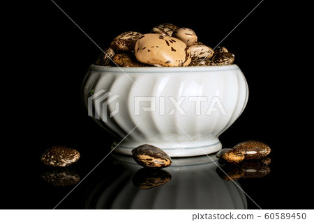 Brown speckled bean isolated on black glass 60589450