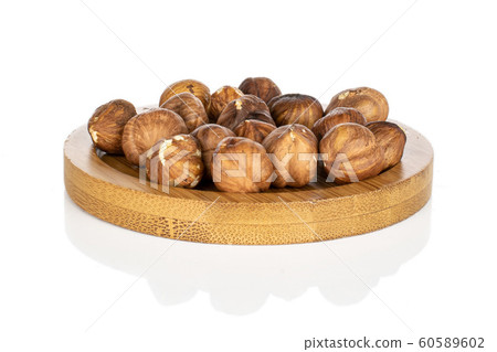 Tasty brown hazelnut isolated on white Tasty brown hazelnut isolated on white 60589602
