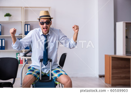 Young employee escaping for summer vacation Young employee escaping for summer vacation 60589903