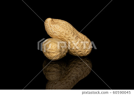 Tasty beige peanut isolated on black glass 60590045