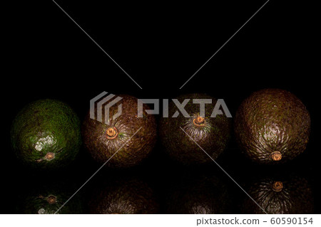Fresh green avocado isolated on black glass 60590154