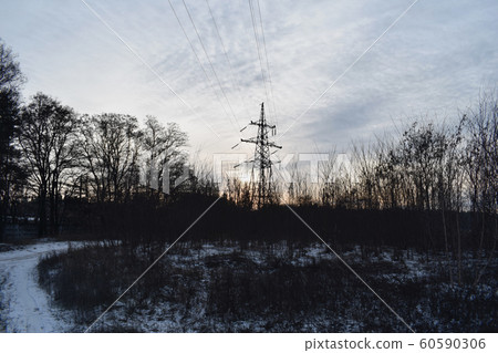 Silhouette of the pylon of a high voltage line. Silhouette of the pylon of a high voltage line. 60590306