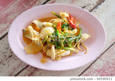 Fried Squid with Salted Egg of Thai foods. 60590911