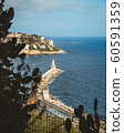 Port of Nice view through the cactuses. Lighthouse in the south coast of France. Azur sea 60591359
