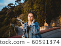 Beautiful caucasian woman smiling. On the streets of old town in Nice, France. 60591374