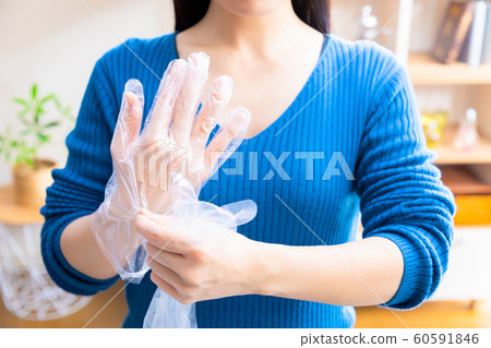 Woman wearing poly gloves 60591846