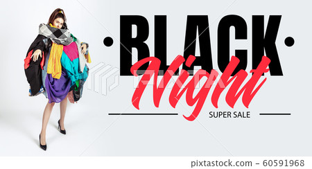 Woman addicted of sales and clothes, black night, sales concept Woman addicted of sales and clothes, black night, sales concept 60591968