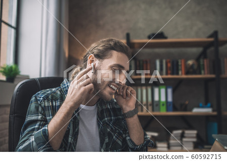 Man expressing his emotions while listening to the music Man expressing his emotions while listening to the music 60592715