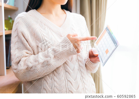 March Pregnant women looking at the calendar 60592865