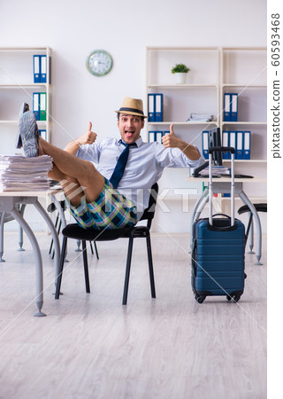 Young employee escaping for summer vacation 60593468