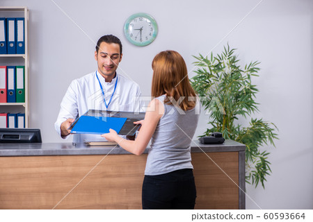 Young patient at the reception in the hospital 60593664