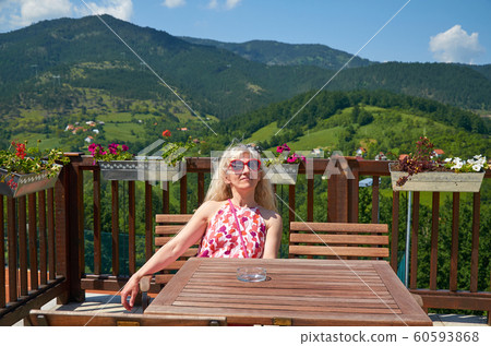 Woman relaxing in a landscape Woman relaxing in a landscape 60593868