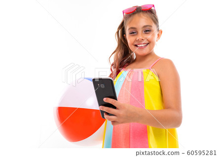 Fashionable teenager girl with red sunglasses and rubber ball communicates with her friends with Fashionable teenager girl with red sunglasses and rubber ball communicates with her friends with 60595281