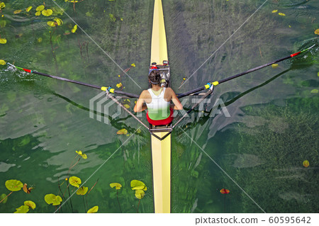 Woman Single sculls rower during the start  60595642