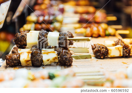 A wide variety of traditional tapas with seafood in Spain at the San Miguel market A wide variety of traditional tapas with seafood in Spain at the San Miguel market 60596592