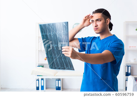 Young male doctor working in the clinic 60596759