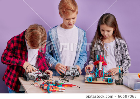 Playful children spend time in engineering club Playful children spend time in engineering club 60597065