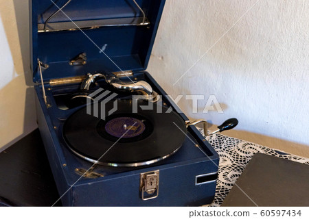 Vinyl record played on old retro vintage phonograph 60597434
