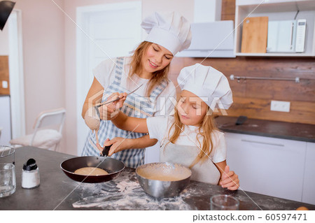 enjoy baking cooking time with mother in kitchen enjoy baking cooking time with mother in kitchen 60597471