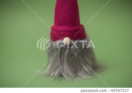Closeup of christmas gnome on green background Closeup of christmas gnome on green background 60597527