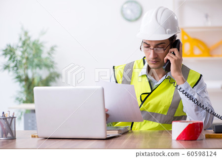 Young male architect working in the office Young male architect working in the office 60598124