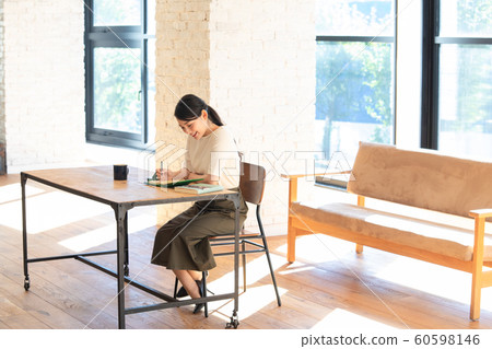 Female staff working at desk Female staff working at desk 60598146