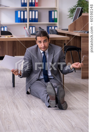 Unhappy male businessman in the office Unhappy male businessman in the office 60598148