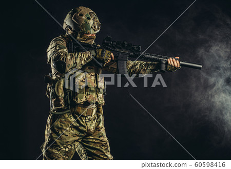 soldier man shooting through fogger smoke soldier man shooting through fogger smoke 60598416
