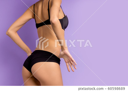 side view on woman standing isaolated in studio 60598689