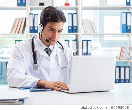 Young male doctor in telehealth concept Young male doctor in telehealth concept 60598698