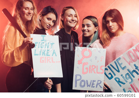 young caucasian women activist holding posters young caucasian women activist holding posters 60599101