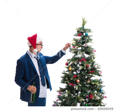 Businessman decorating christmas tree isolated on white Businessman decorating christmas tree isolated on white 60600049