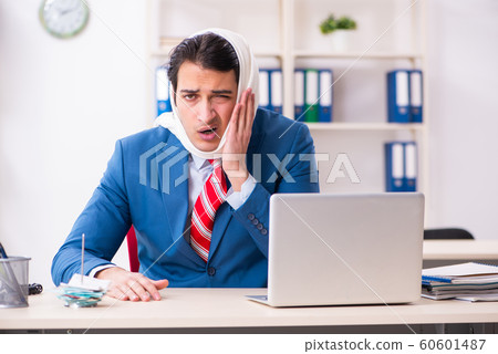 Young male employee suffering in the office 60601487
