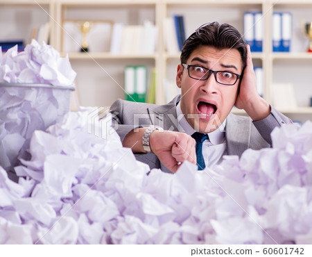 Businessman in paper recycling concept in office 60601742